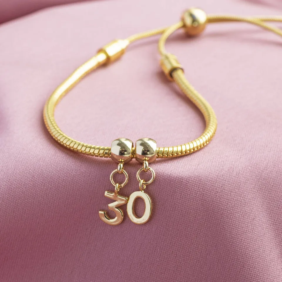 Joy by Corrine Smith Birthday Charm Slider Armband Gold