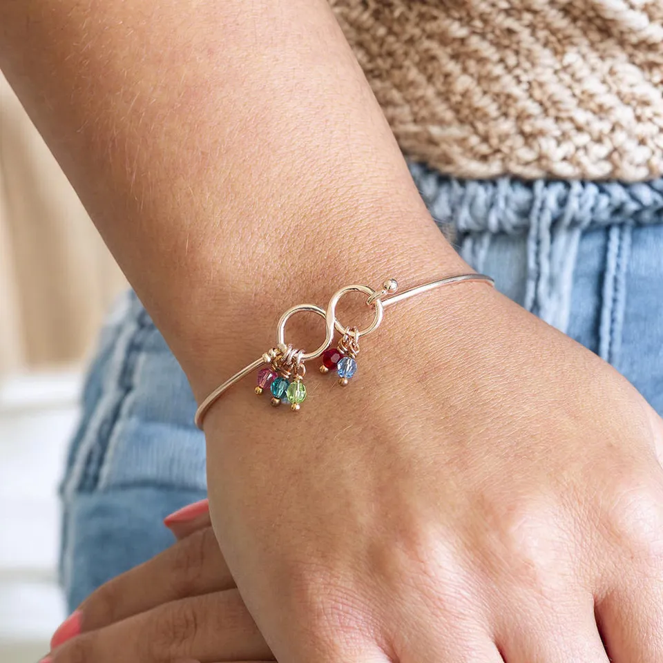 Joy by Corrine Smith Family Infinity Armreif mit Geburtsstein